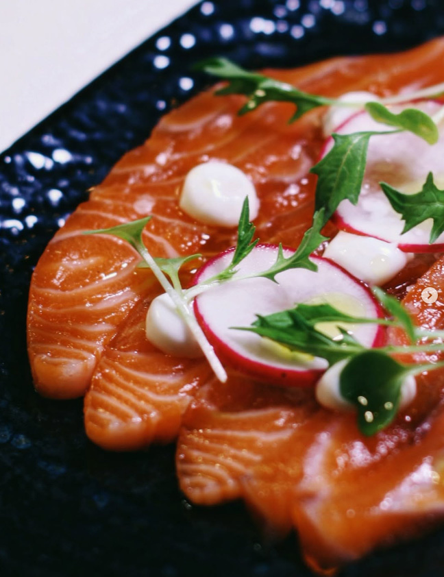 Cured Scottish sea trout with baby radish and mizuna